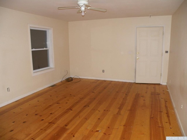 unfurnished room featuring ceiling fan and light wood-type flooring