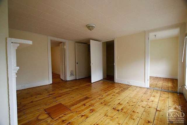 unfurnished bedroom featuring light hardwood / wood-style floors