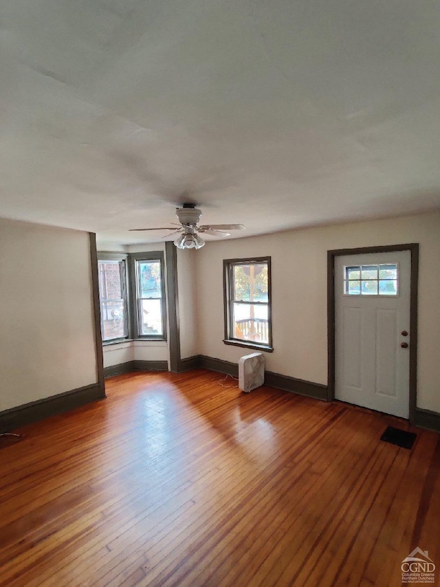 entrance foyer with light hardwood / wood-style flooring and ceiling fan