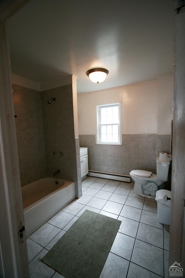 full bathroom featuring tile patterned flooring, toilet, baseboard heating, and tile walls