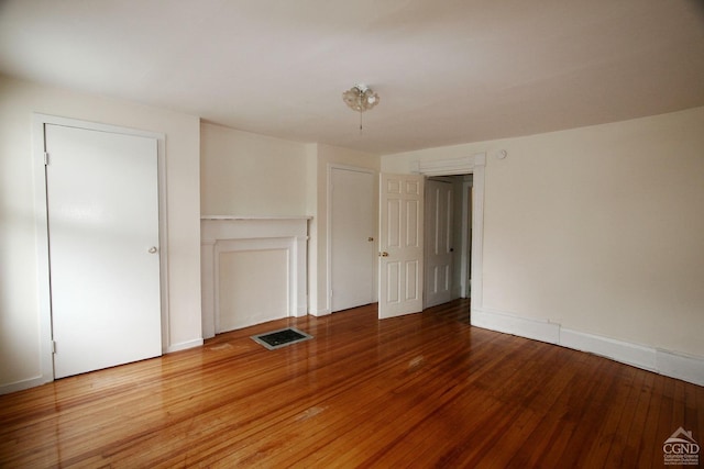 interior space with wood-type flooring and a closet