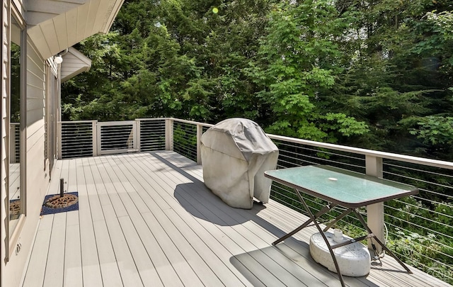 wooden terrace featuring area for grilling