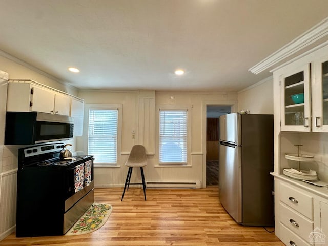 kitchen with a baseboard heating unit, white cabinets, crown molding, light wood-type flooring, and stainless steel appliances