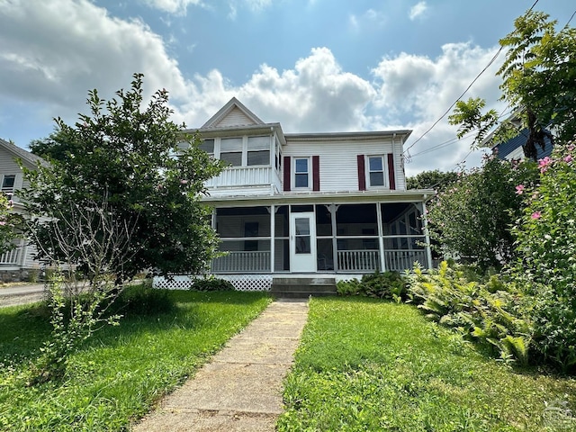 view of front facade with a sunroom