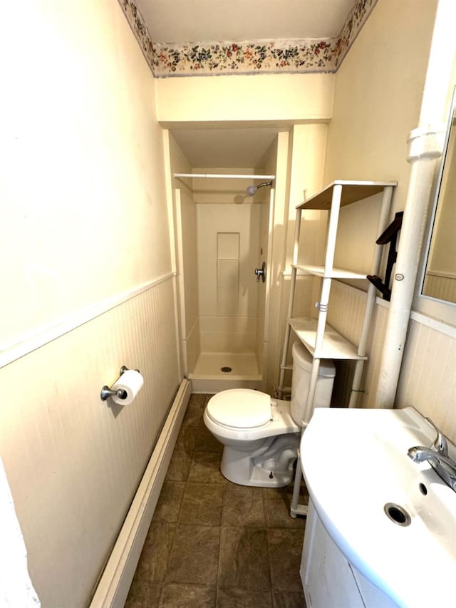 bathroom with vanity, toilet, and walk in shower