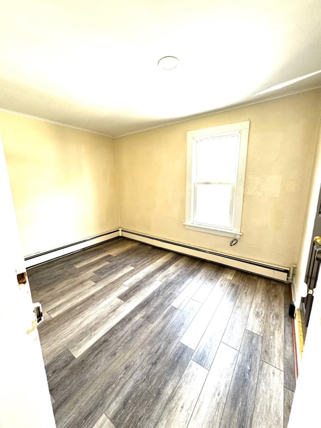 empty room with hardwood / wood-style floors