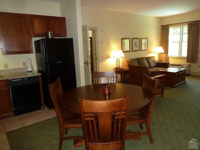 view of carpeted dining area