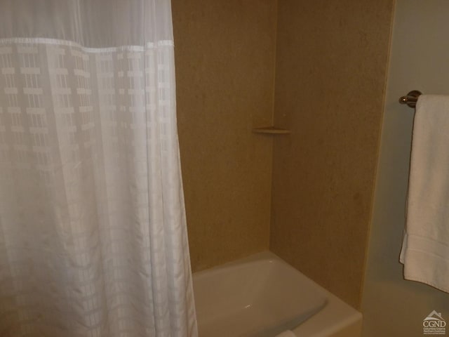 bathroom with shower / bath combination with curtain