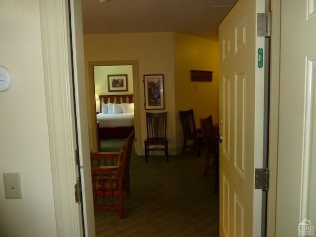 corridor with dark carpet