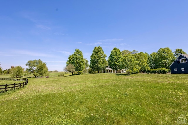 view of yard with a rural view