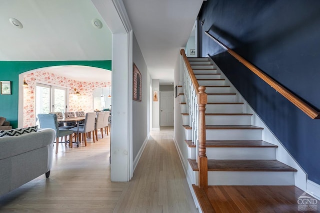 stairway with hardwood / wood-style flooring