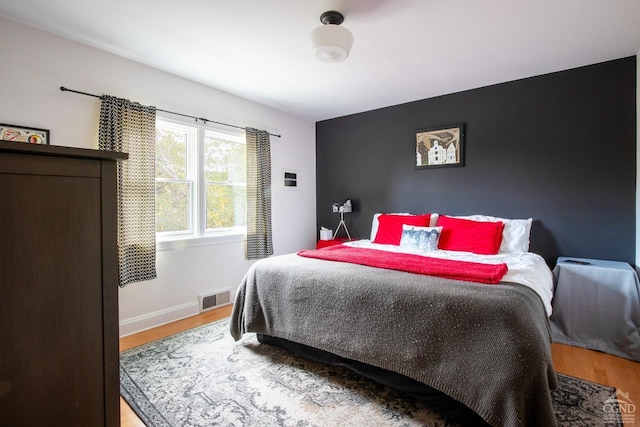 bedroom with light hardwood / wood-style flooring