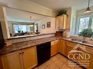 kitchen with kitchen peninsula, crown molding, pendant lighting, and black dishwasher