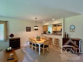 dining area with carpet