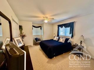 bedroom featuring ceiling fan and carpet floors