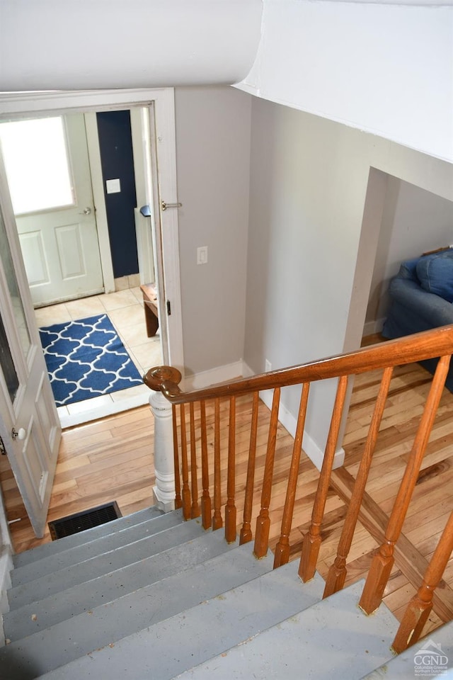 stairway with wood-type flooring