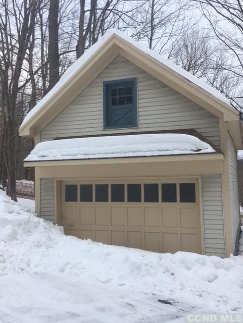 view of snow covered garage