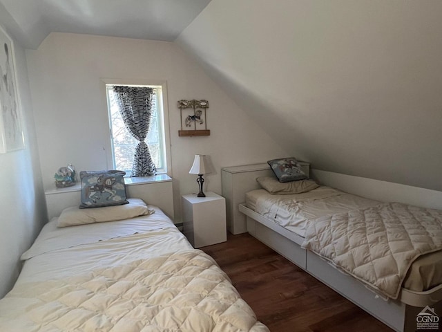 bedroom featuring dark hardwood / wood-style floors and lofted ceiling