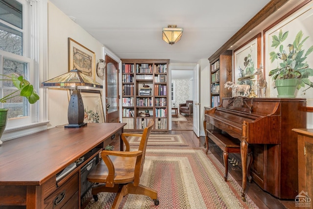 office with a wealth of natural light and wood finished floors