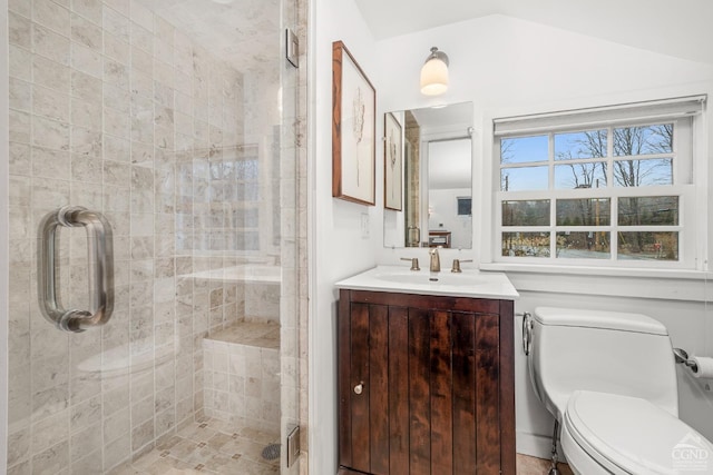 full bath featuring toilet, vaulted ceiling, vanity, and a stall shower