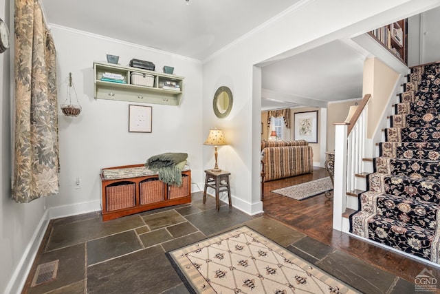 interior space with stone tile flooring, ornamental molding, and baseboards