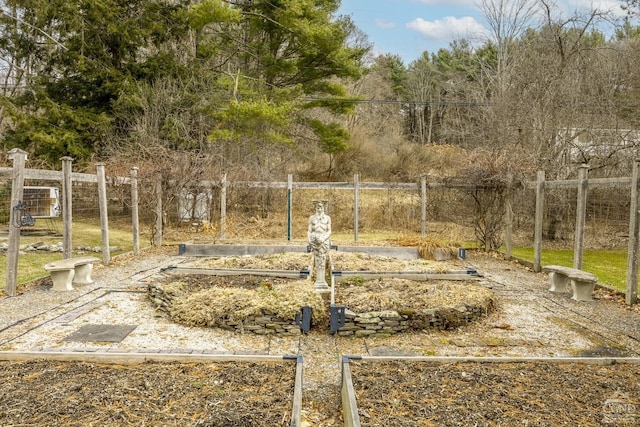 view of yard with a garden and fence