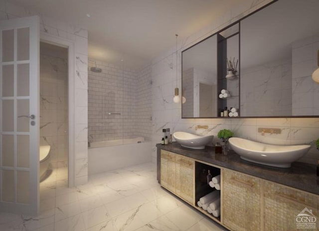 bathroom featuring a tile shower, vanity, and tile walls