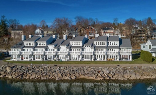 rear view of house with a water view