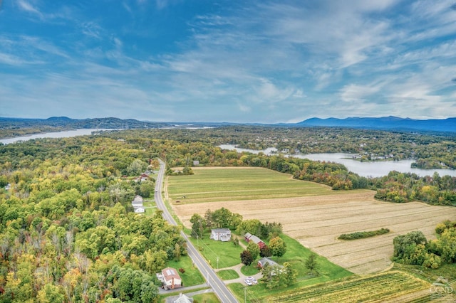 aerial view featuring a rural view and a water and mountain view