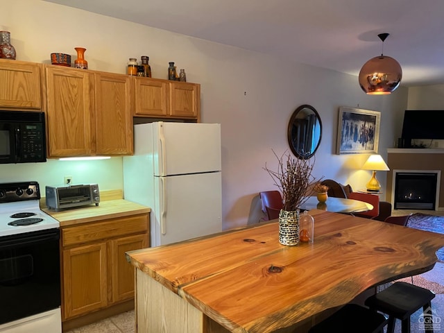 kitchen featuring wood counters, electric range oven, white refrigerator, and decorative light fixtures