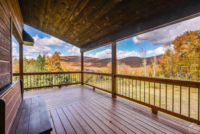 wooden terrace featuring a mountain view