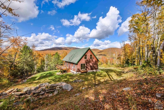 view of outdoor structure featuring a mountain view and a yard