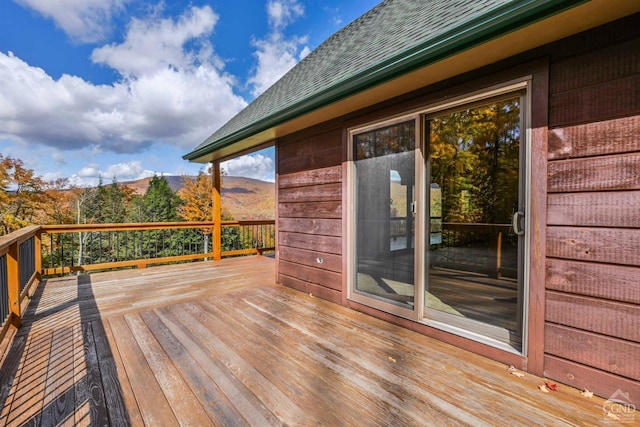 wooden deck with a mountain view