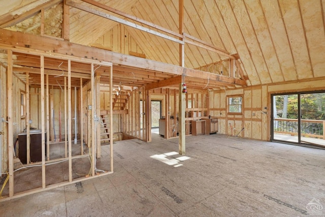 miscellaneous room with high vaulted ceiling