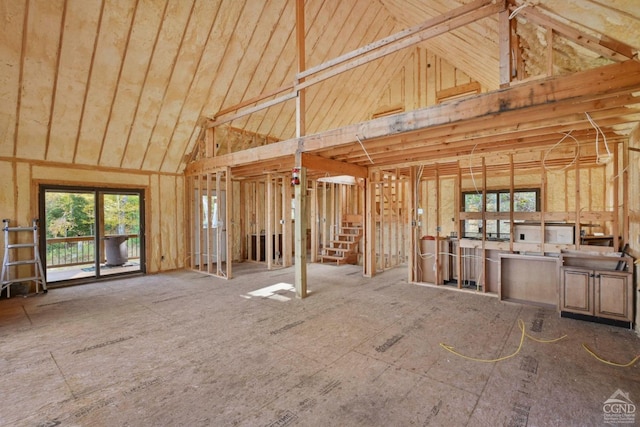 miscellaneous room with high vaulted ceiling