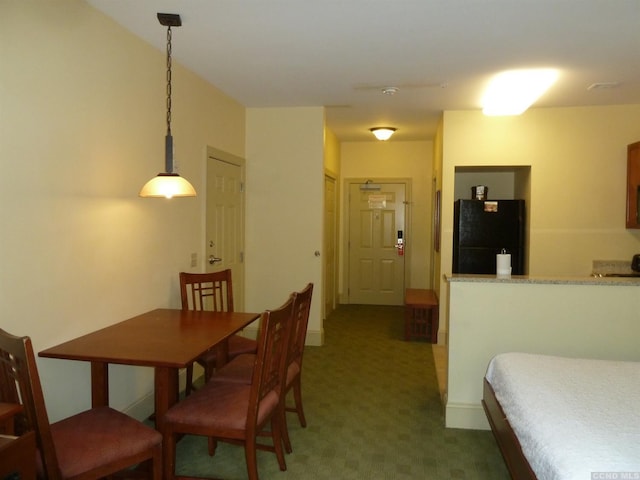 view of carpeted dining area