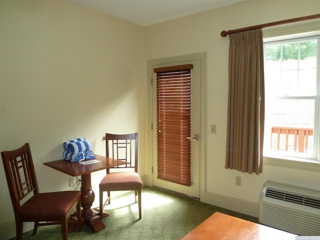 sitting room featuring a wall unit AC