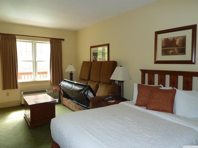 bedroom with carpet flooring and radiator heating unit