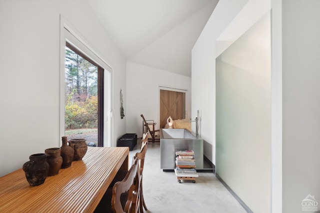 dining space featuring lofted ceiling