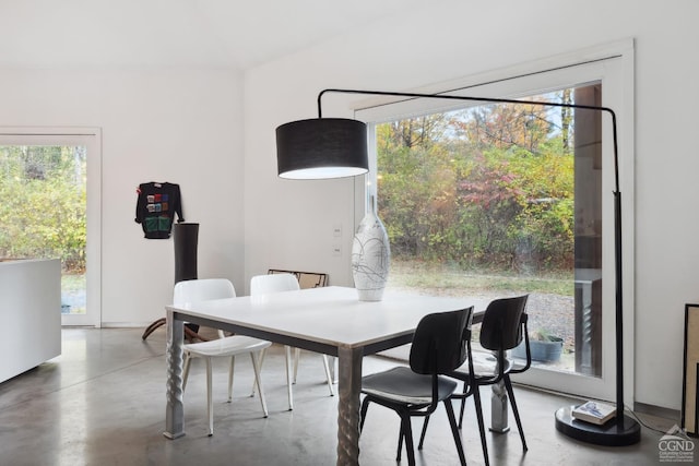 dining area with concrete flooring