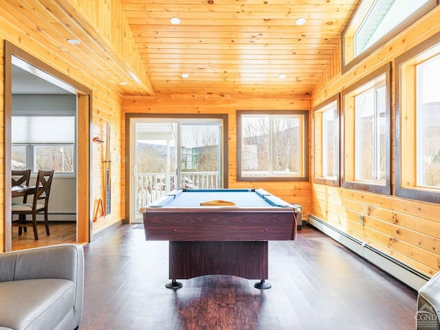 playroom featuring lofted ceiling, wooden ceiling, wood walls, and baseboard heating