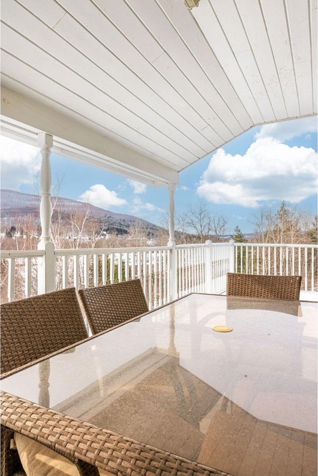 view of patio / terrace featuring a balcony and a mountain view