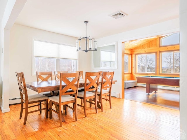 dining room featuring a baseboard radiator, pool table, a notable chandelier, and light wood-type flooring