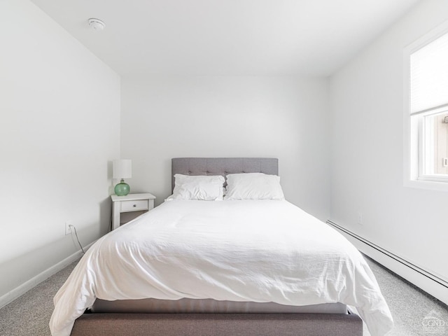 bedroom featuring a baseboard radiator and carpet flooring