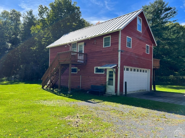 view of home's exterior with a yard and a garage