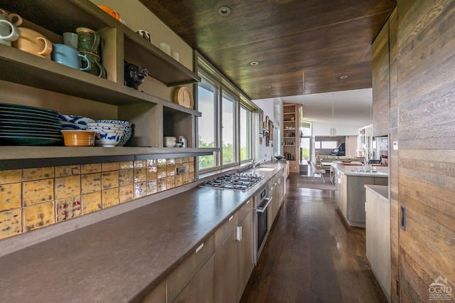 bar with wooden ceiling, sink, dark wood-type flooring, and appliances with stainless steel finishes