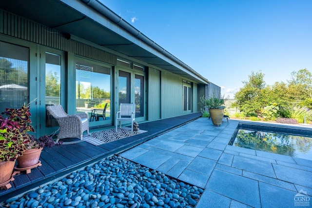 view of swimming pool featuring a deck