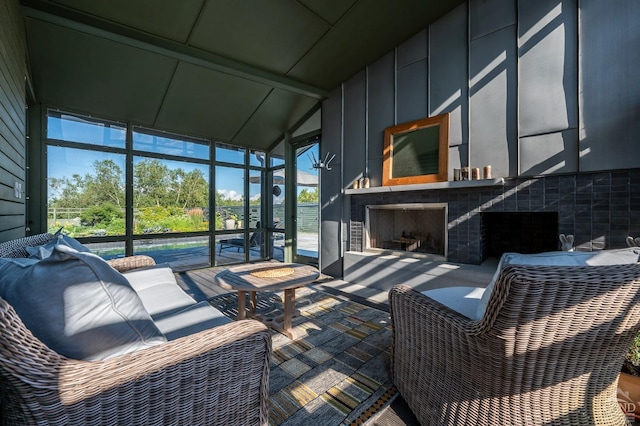 sunroom / solarium featuring lofted ceiling