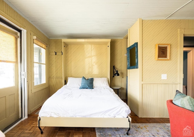 bedroom with wooden walls