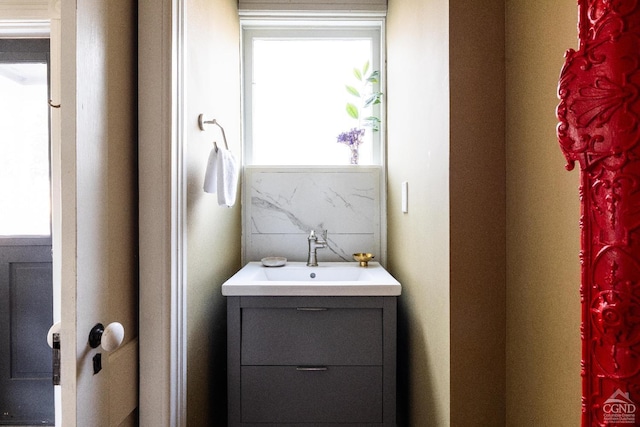 bathroom featuring backsplash and vanity